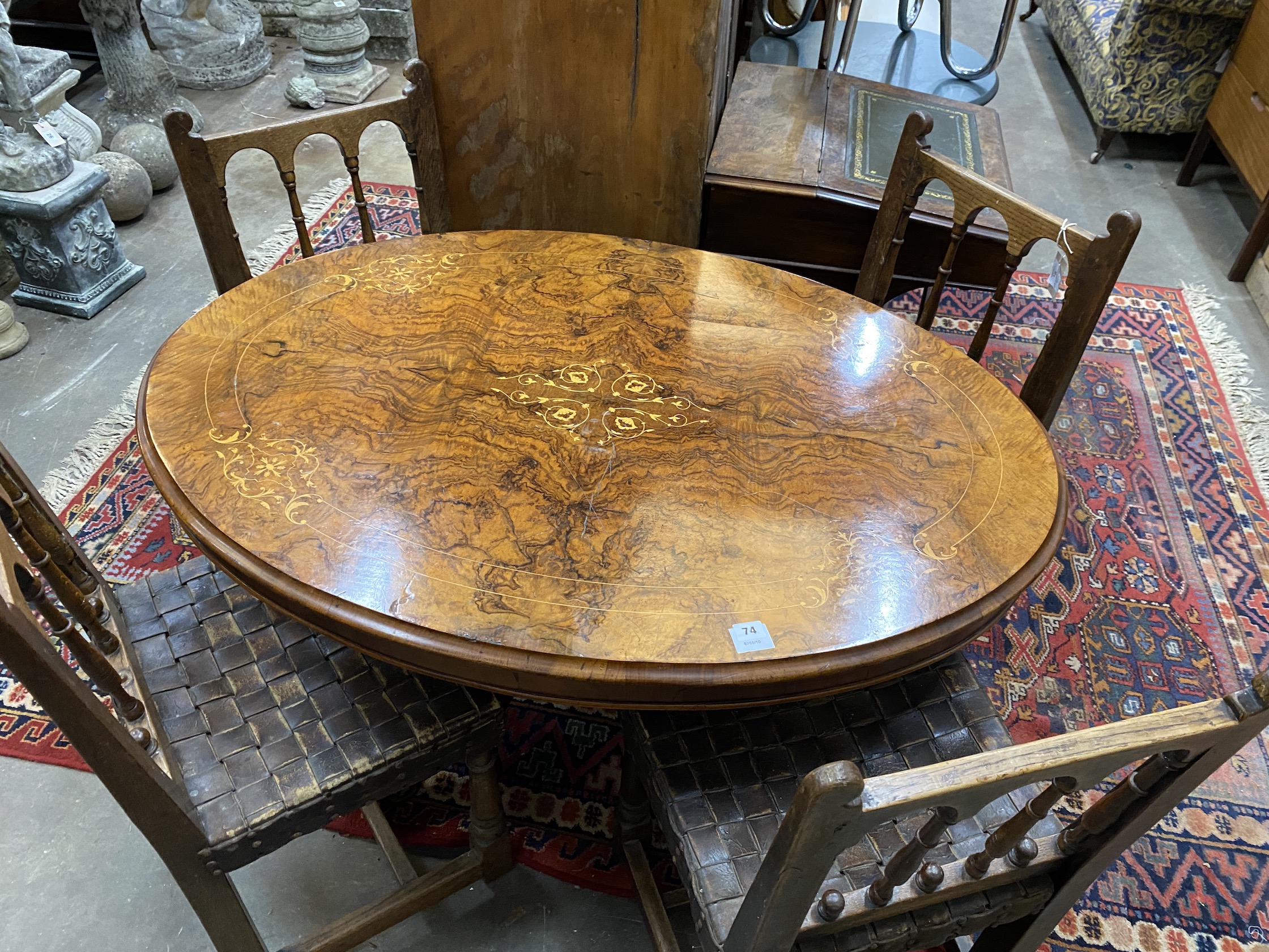 A Victorian inlaid figured walnut oval tilt top loo table, width 120cm, depth 86cm, height 72cm